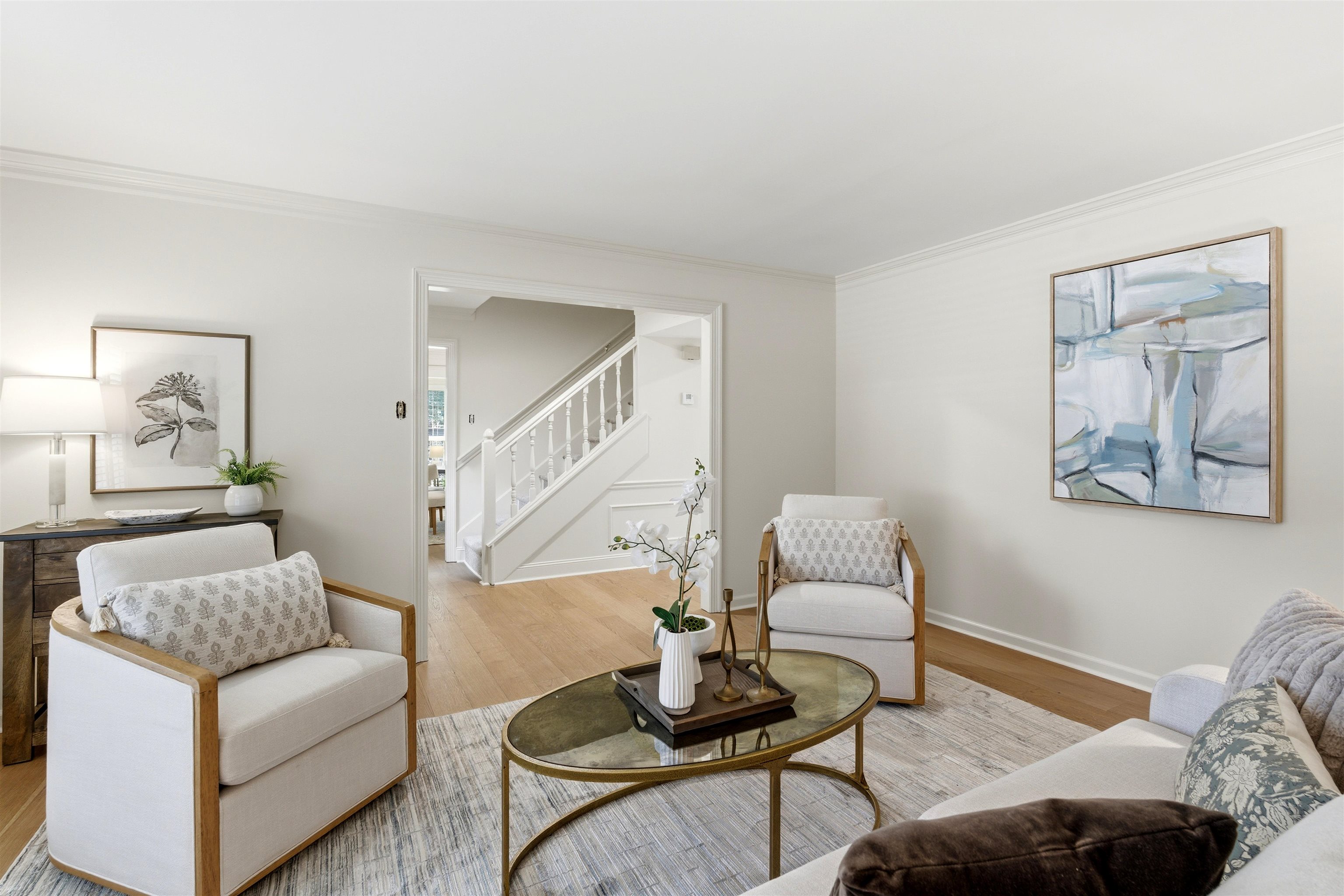 1984 Allenby Road Germantown, TN 38139 - Photo 22 of 37 Living area with wood-finish flooring, light-toned wall paint, and crown molding