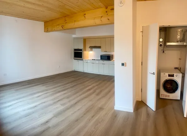 a view of a kitchen storage and a utility room