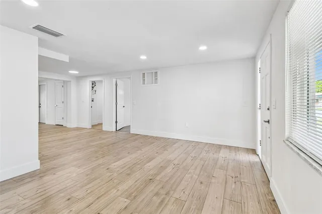 a kitchen with stainless steel appliances a stove a microwave and cabinets