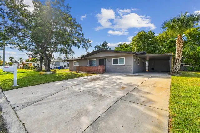 a view of house with yard outdoor seating and entertaining space
