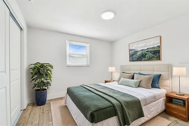 a bathroom with a toilet sink vanity and mirror