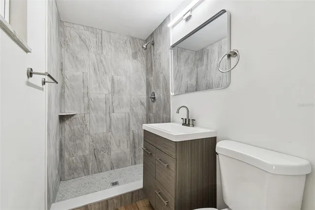 a view of a house with pool and chairs