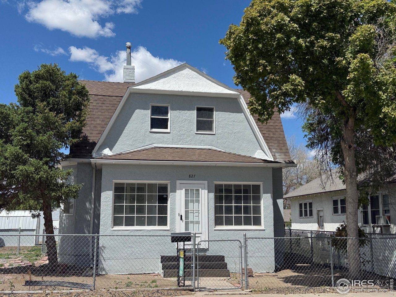 a front view of a house with garage