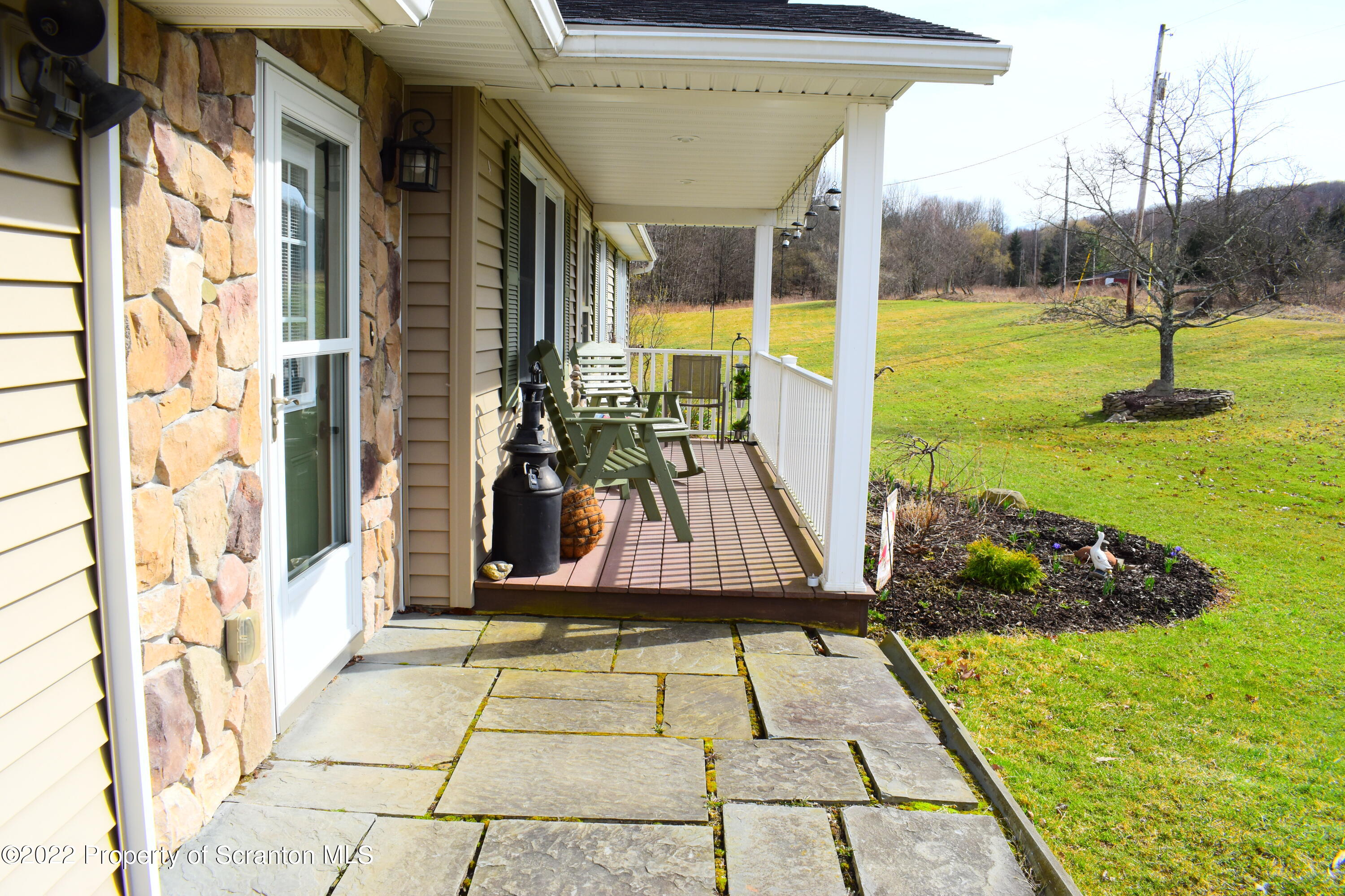 216 Blake Road Friendsville, PA 18818 - Photo 3 of 47 a view of a porch with a table and chairs