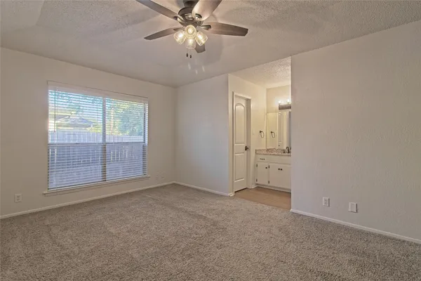 a kitchen with granite countertop a stove and a microwave