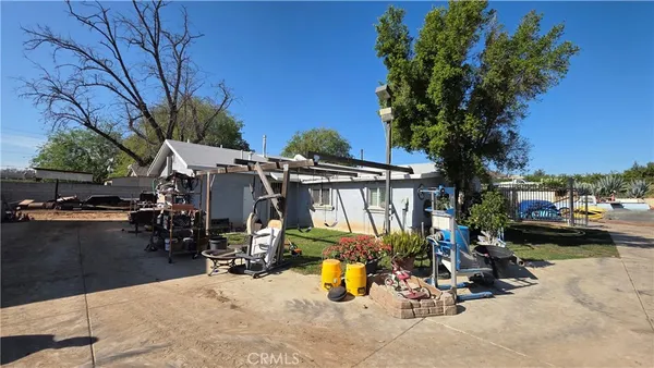 a view of a backyard patio and fire pit