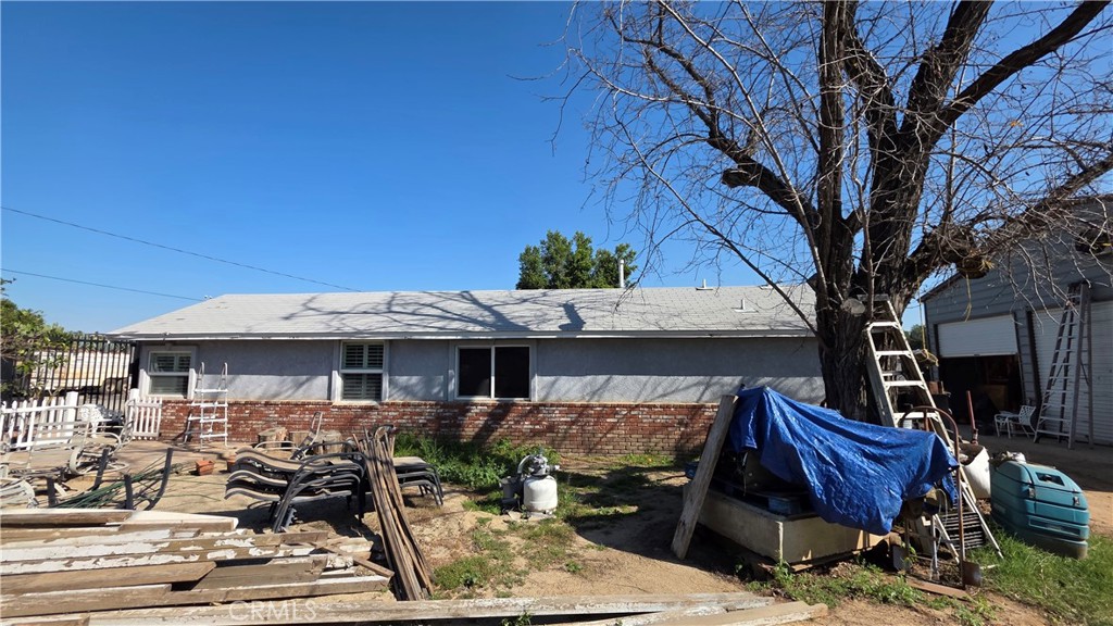 1642 Fourth Street Norco, CA 92860 - Photo 15 of 35 a front view of house with yard outdoor seating and barbeque oven