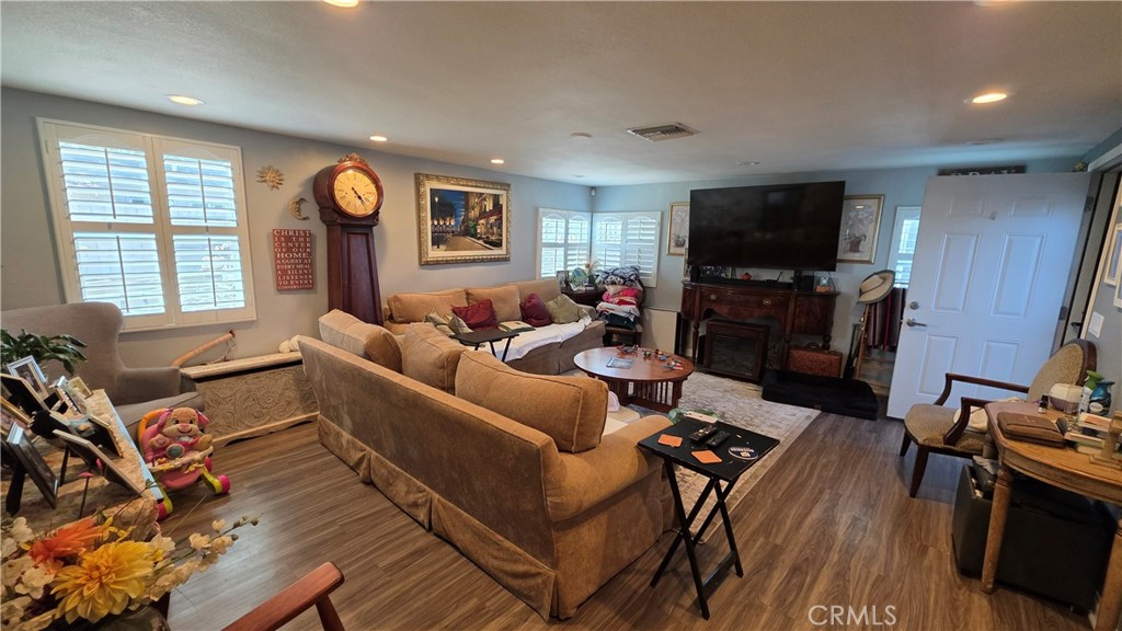 1642 Fourth Street Norco, CA 92860 - Photo 21 of 35 a living room with furniture and a flat screen tv