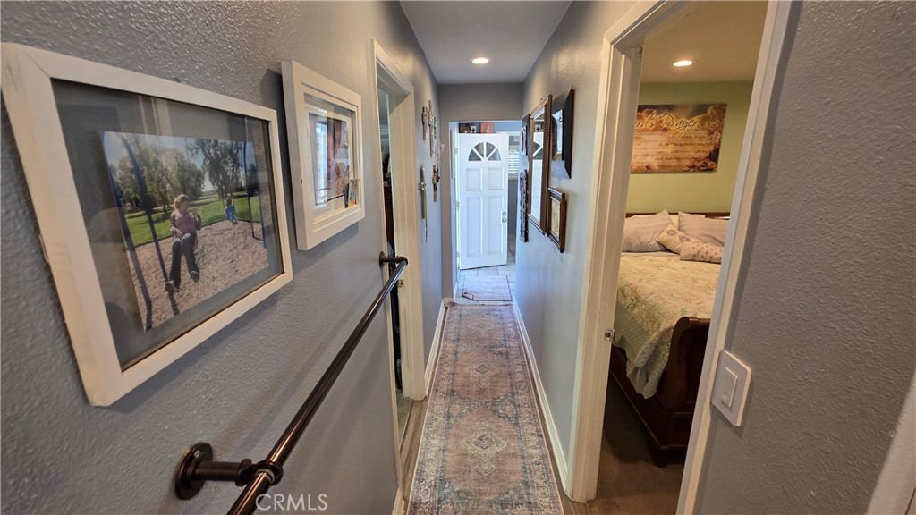1642 Fourth Street Norco, CA 92860 - Photo 23 of 35 a view of a hallway with wooden floor and glass door