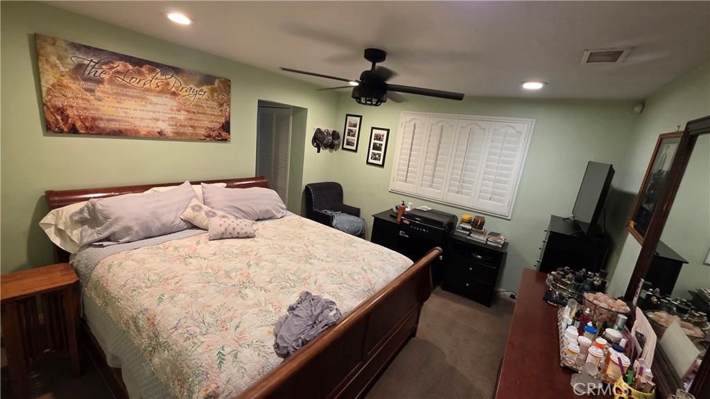 1642 Fourth Street Norco, CA 92860 - Photo 26 of 35 a bed room with furniture and a flat screen tv