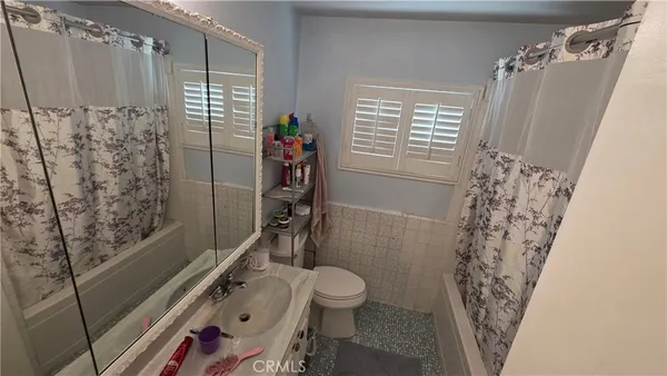 a view of walk in closet with clothes
