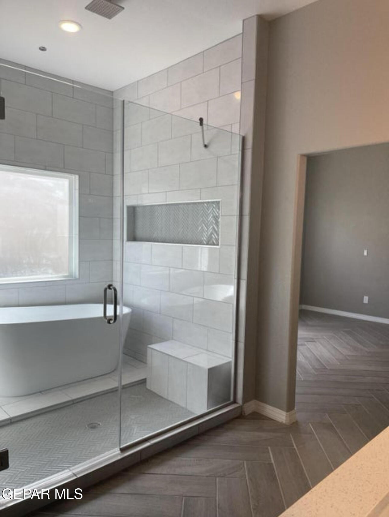 6031 Summer Ridge Sunland Park, NM 88008 - Photo 10 of 13 a bathroom with a glass shower door