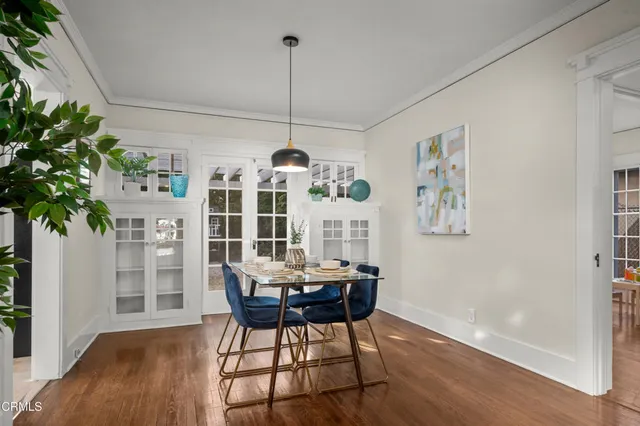 a view of a dining room with furniture window and wooden floor