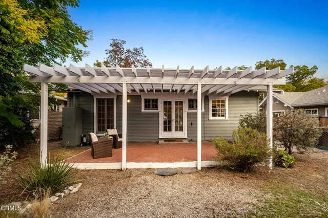 a view of a house with porch and chairs
