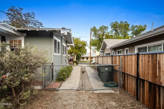 an aerial view of a house with outdoor space