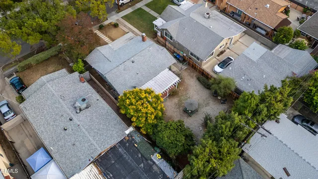 an aerial view of a house with a yard
