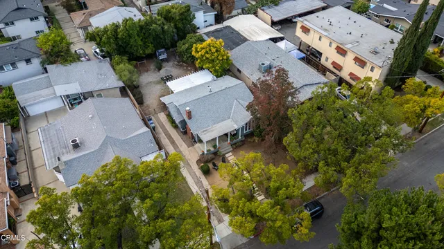 an aerial view of residential houses with outdoor space