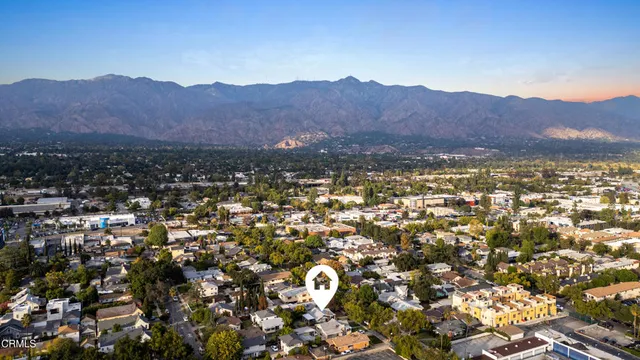 an aerial view of residential house and mountain view