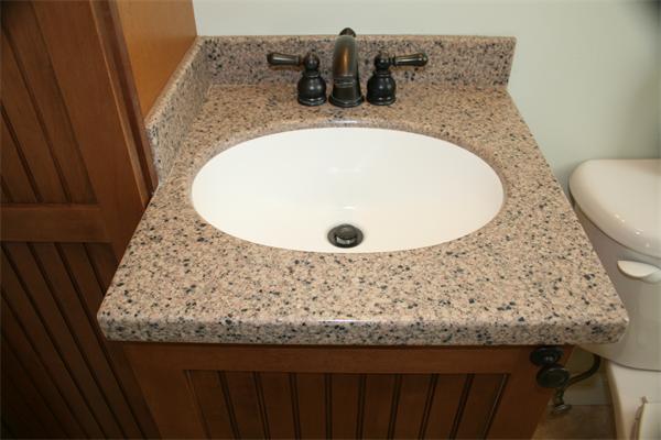 5 Taft Avenue Maynard, MA 01754 - Photo 10 of 26 a bathroom with a granite countertop sink and mirror