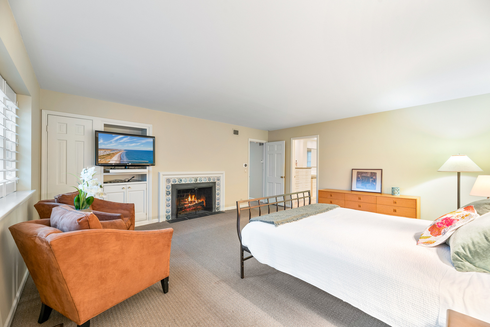 200 Hazel Avenue Glencoe, IL 60022 - Photo 23 of 51 a bedroom with a bed and a fireplace