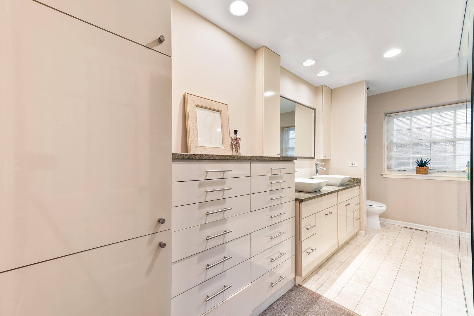 200 Hazel Avenue Glencoe, IL 60022 - Photo 24 of 51 a bathroom with a double vanity sink and a mirror