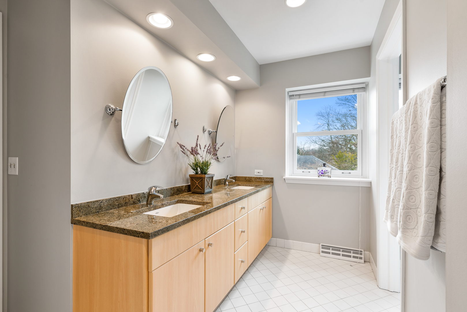 200 Hazel Avenue Glencoe, IL 60022 - Photo 28 of 51 a bathroom with a granite countertop sink a mirror and a shower