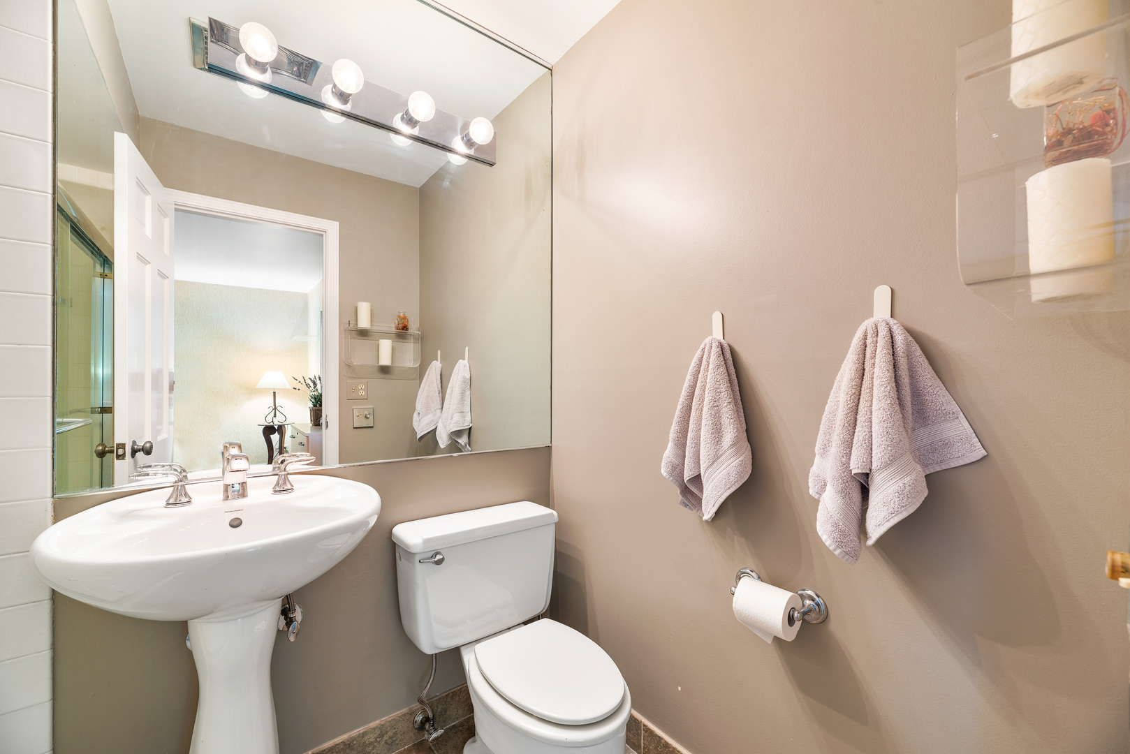 200 Hazel Avenue Glencoe, IL 60022 - Photo 31 of 51 a bathroom with a sink vanity mirror and toilet