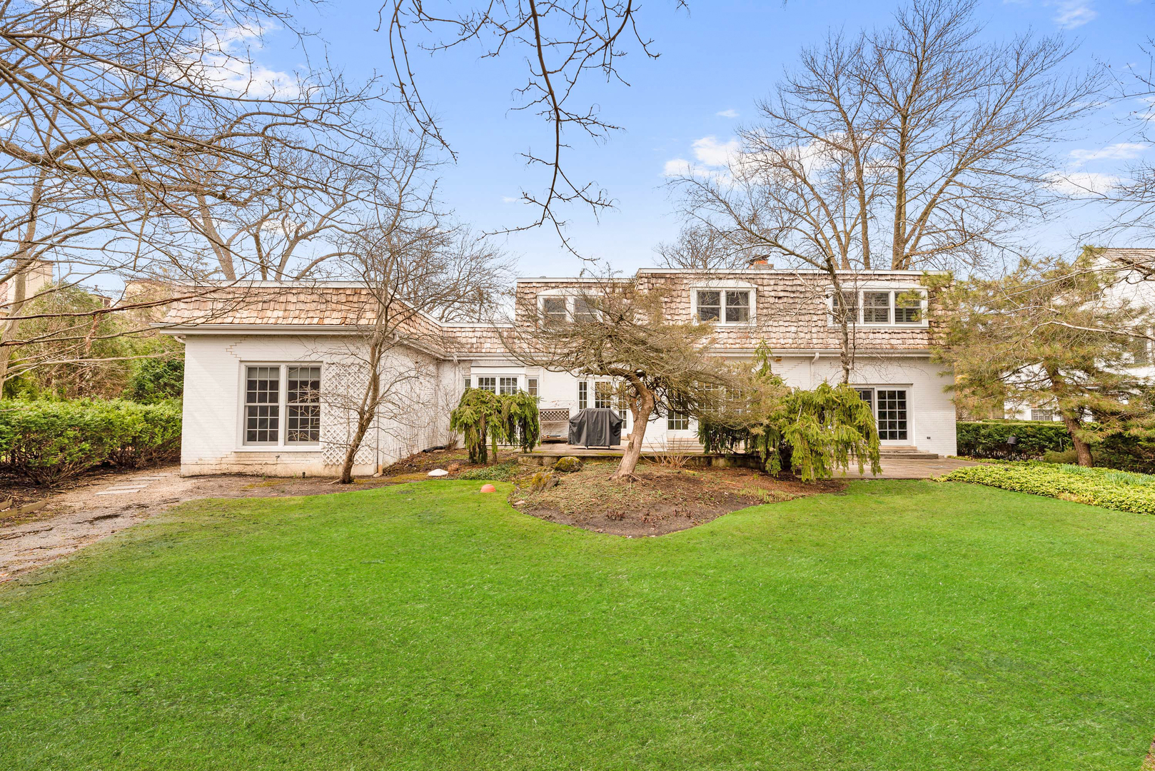 200 Hazel Avenue Glencoe, IL 60022 - Photo 37 of 51 a view of a yard with a house in the background