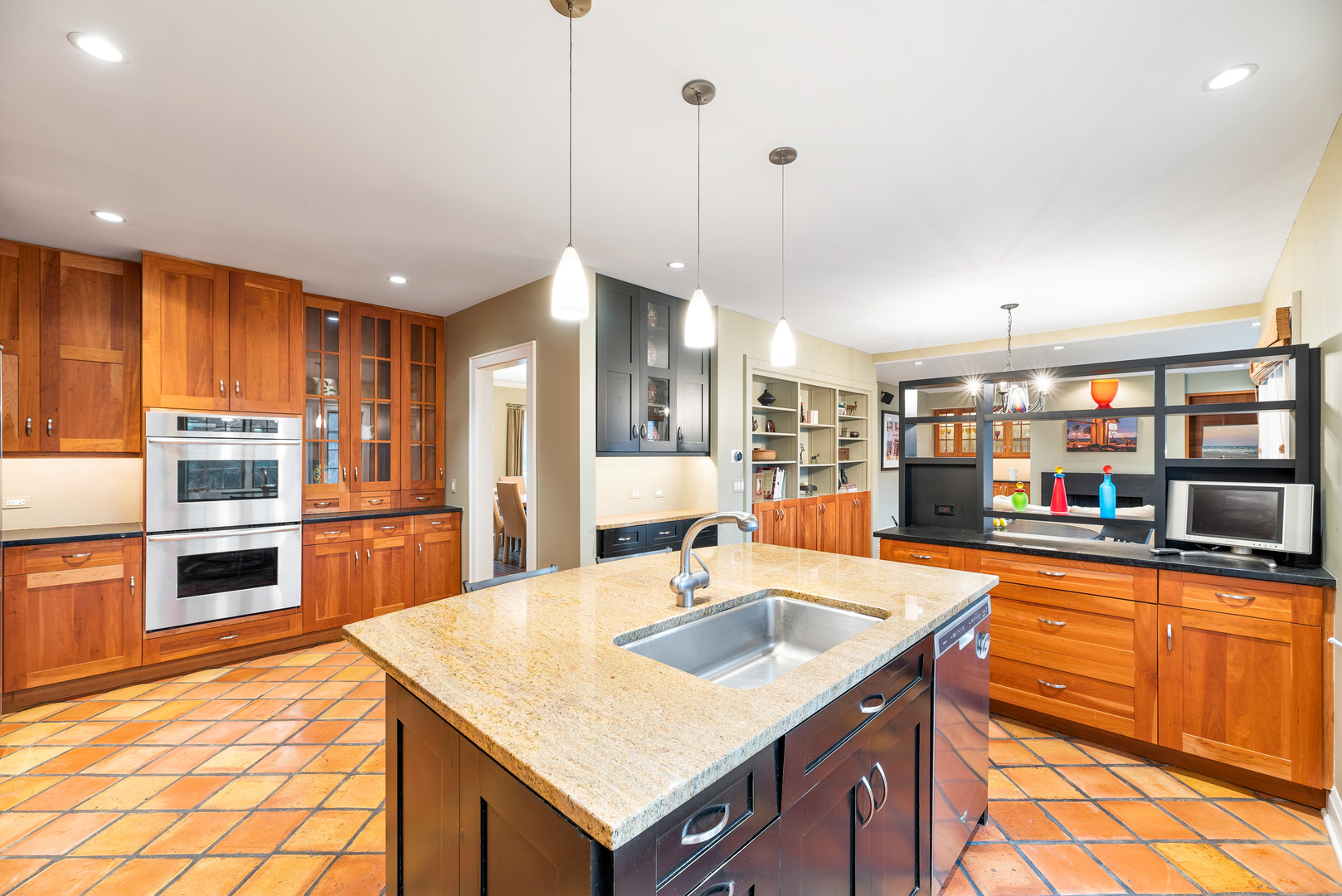200 Hazel Avenue Glencoe, IL 60022 - Photo 5 of 51 a kitchen with stainless steel appliances granite countertop a sink a stove and a refrigerator