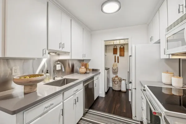 a kitchen with a sink and cabinets