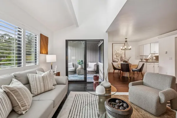 a living room with furniture and a table