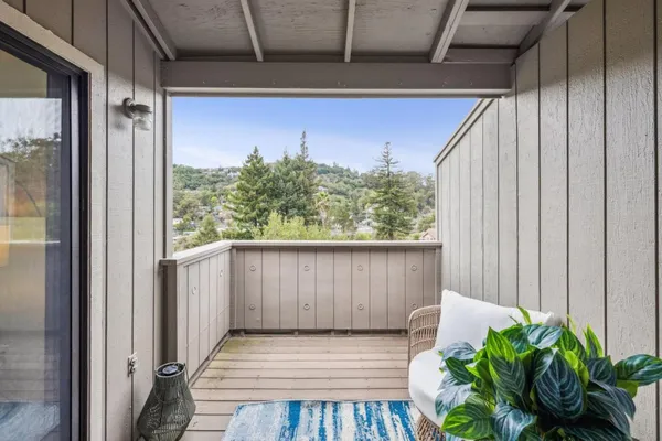 a view of a porch with wooden floor