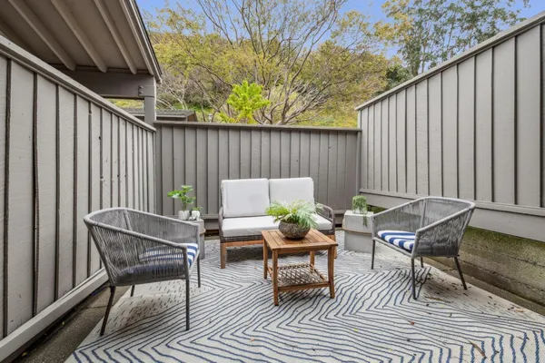 a outdoor space with patio couch and glass door