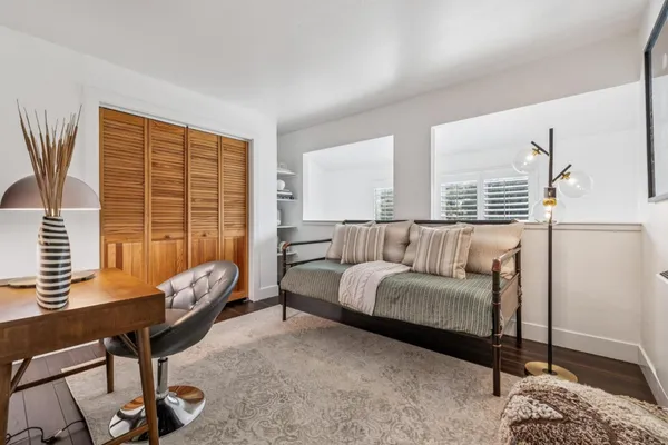 a bedroom with furniture and a bed