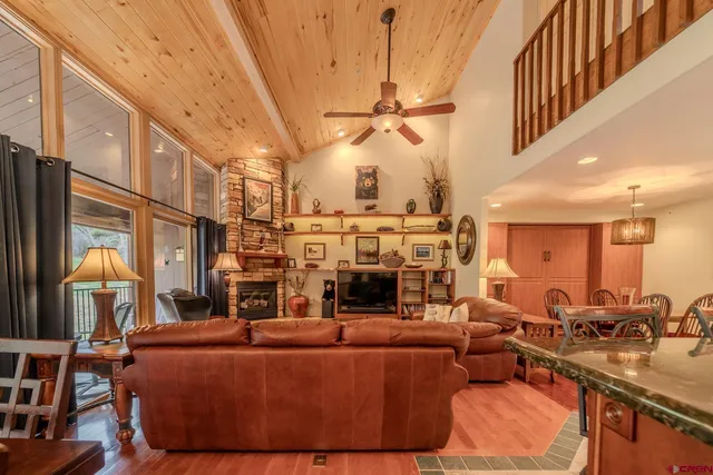 a living room with lots of furniture and a chandelier