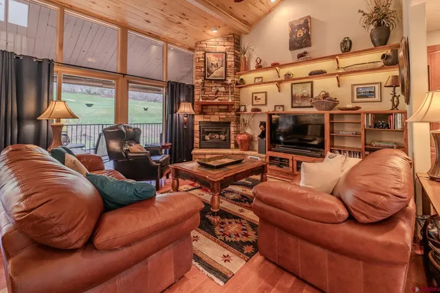 a outdoor living space with furniture and a fireplace