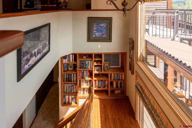 a view of a balcony and wooden floor