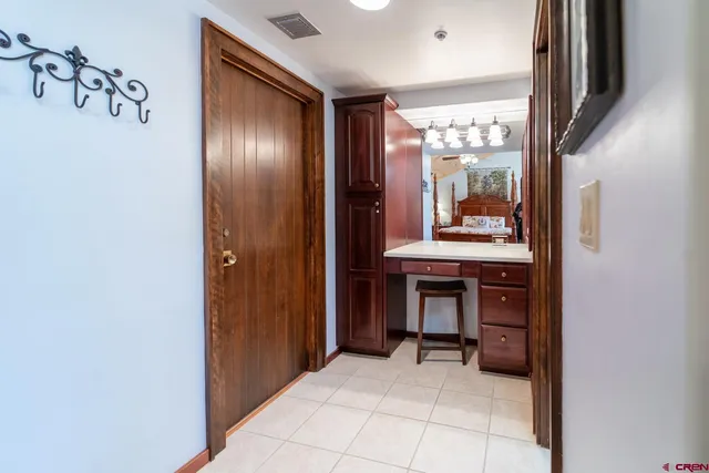 a view of an entryway with table and door