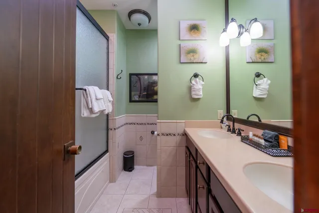 a bathroom with a sink vanity and mirror