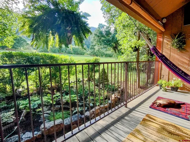 a view of balcony with wooden floor