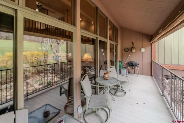a view of balcony with furniture