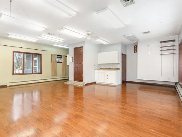 a room with a table and chairs