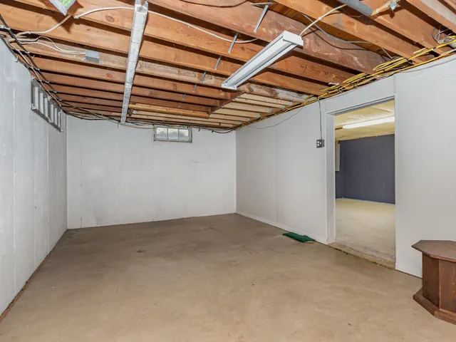 a view of backyard of snow with trees