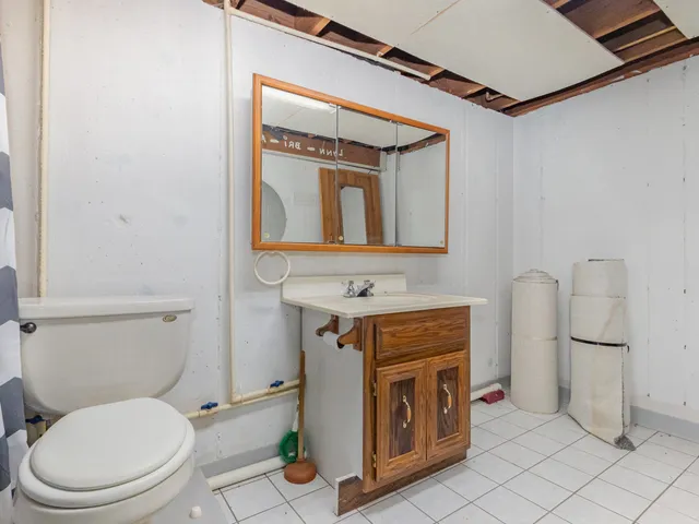 a front view of a house with yard and green space