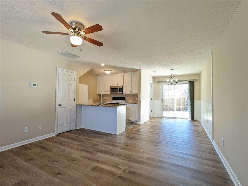 a view of a kitchen with a sink and a window