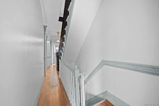 a view of a hallway with staircase