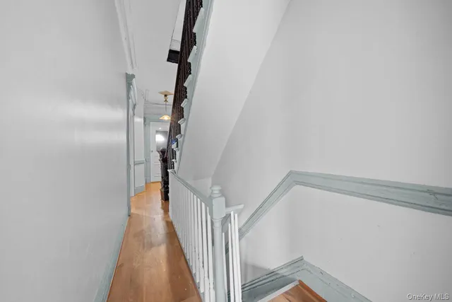 a view of a hallway with staircase