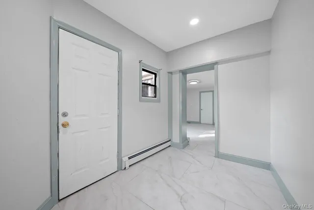 an empty room with a bathroom