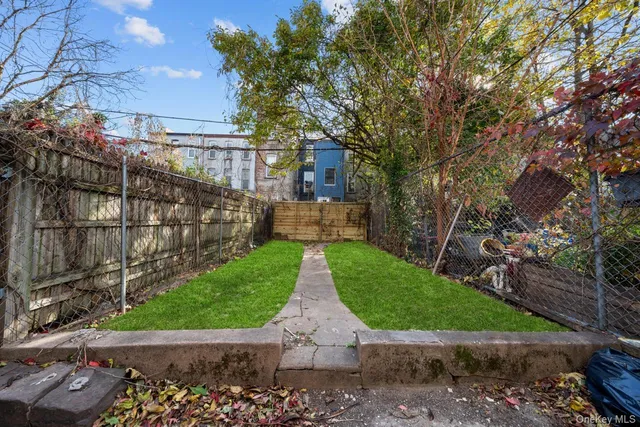 a view of a back yard of the house