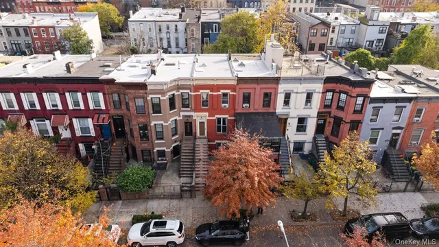 a view of a brick building with many windows